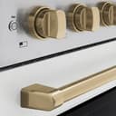 Autograph Edition 36 In. 5.2 Cu. Ft. Paramount Induction Range With 5 Element Cooktop And Electric Convection Oven In Stainless Steel With White Matte Door And Champagne Bronze Accents view 4